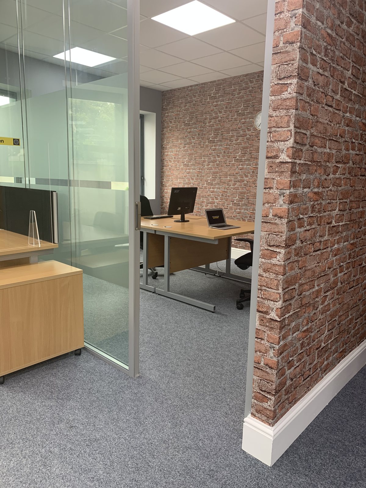 Private office space in Wicklow with glass partition and exposed brick — Wicklow Hub, Newtown Mount Kennedy